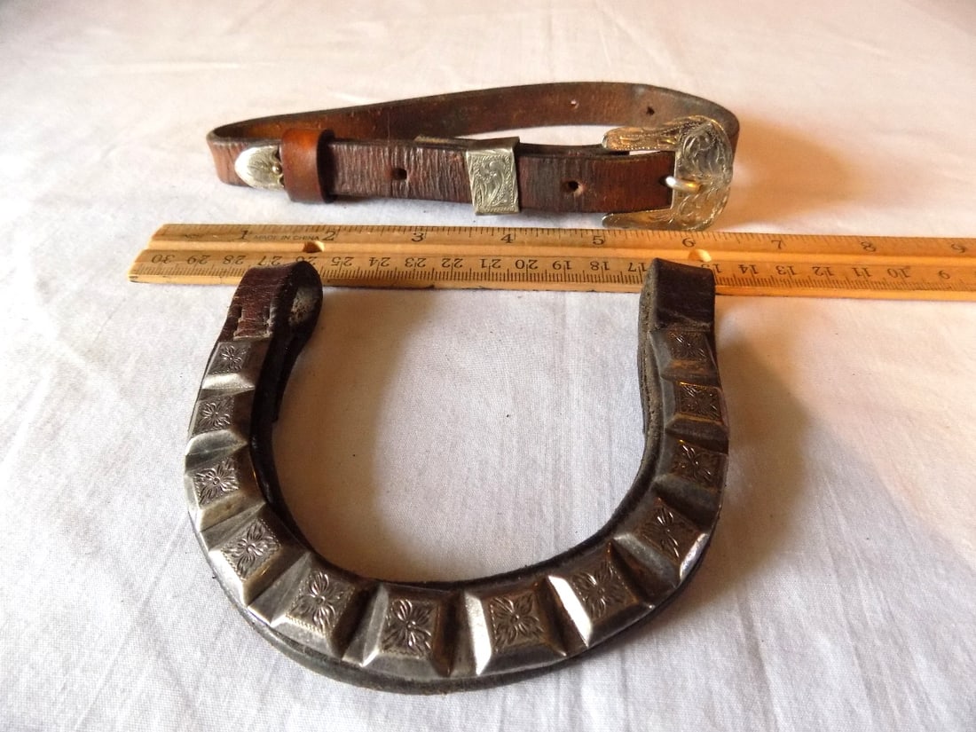 Vintage cowboy western engraved silver mounted leather belt and leather horseshoe: Vintage cowboy western engraved silver mounted leather belt and leather horseshoe. Please see photos with ruler for size. In very good original as found condition. Great quality and detail. For in hou