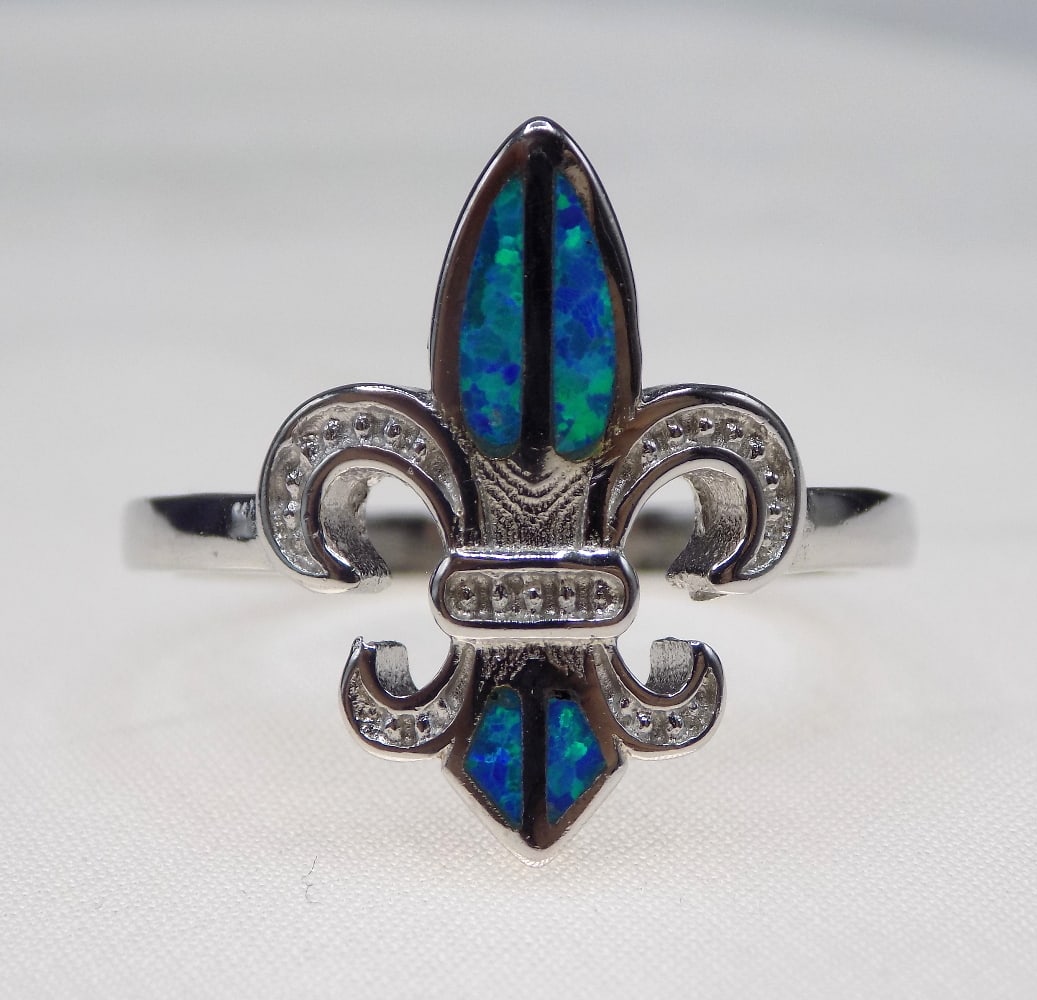 Beautiful Australian opal and topaz sterling silver ring: Beautiful Australian opal and topaz sterling silver ring. Size 9. For in house shipping, please call Mike at Thriftiques 319-321-0613.