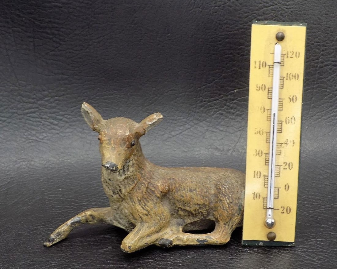 Neat vintage German cast metal thermometer with deer: Neat vintage German cast metal thermometer with deer. 5 1/8 tall x 3 7/8 inches wide. Original patina. Beautiful colors. In very good original as found condition. Great quality and detail. For in hous