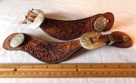 Ornate vintage cowboy tooled leather spur straps with silver buckle and concho