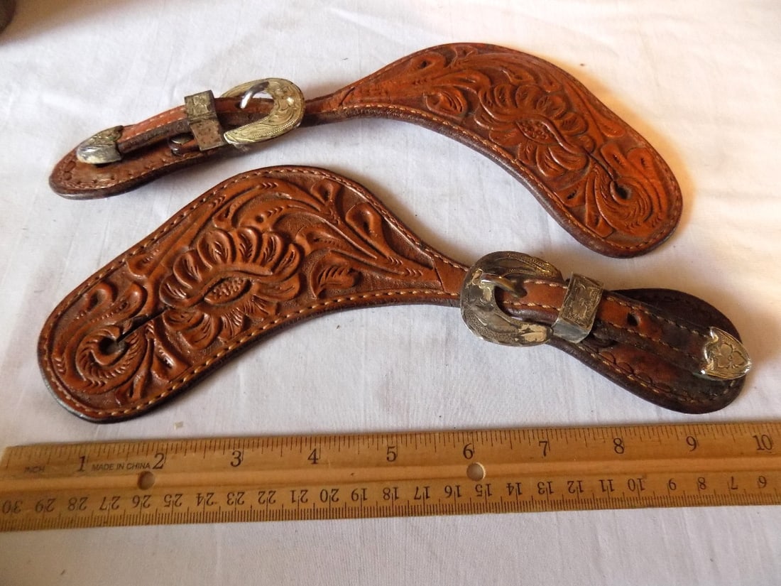 Ornate vintage cowboy tooled leather spur straps with silver buckle: Ornate vintage cowboy tooled leather spur straps with silver buckle. Marked on buckle. Please see photos with ruler for size. In very good original as found condition. Great quality and detail. For in