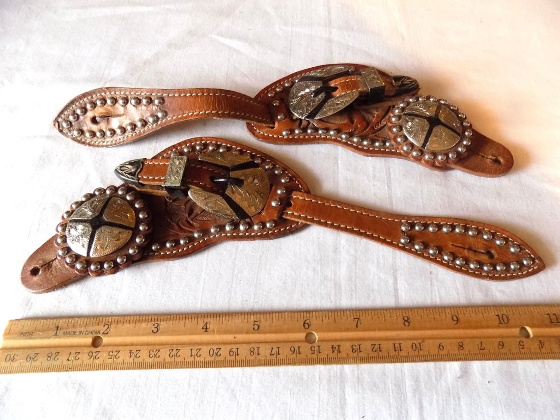 Ornate vintage cowboy tooled leather spur straps with engraved silver buckle and concho: Ornate vintage cowboy tooled leather spur straps with engraved silver buckle and concho. Marked on buckle. Please see photos with ruler for size. In very good original as found condition. Great qualit