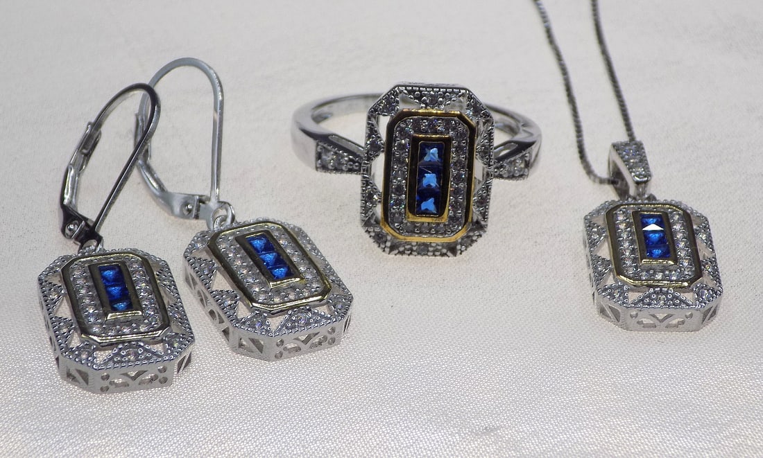Beautiful sapphire sterling silver ring: Beautiful sapphire sterling silver ring, pendant and earrings. Lab created. Ring size 7. For in house shipping, please call Mike at Thriftiques 319-321-0613