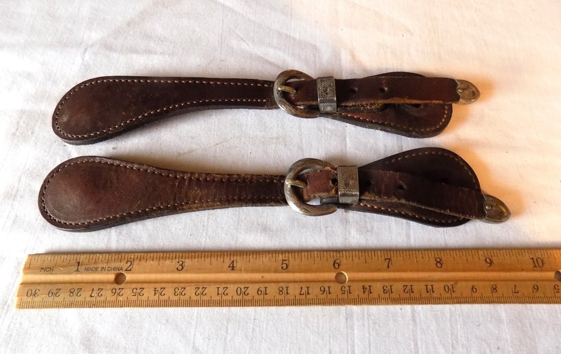 Ornate vintage cowboy tooled leather spur straps with engraved silver buckle: Ornate vintage cowboy tooled leather spur straps with engraved silver buckle. Marked Vogt and sterling on buckle. Please see photos with ruler for size. In very good original as found condition. Great