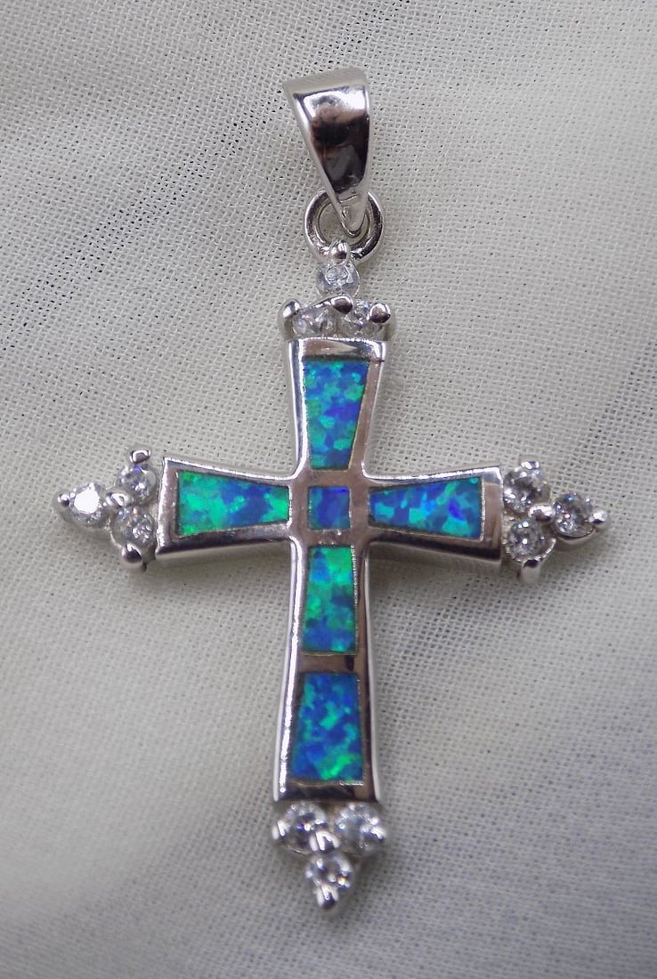 Beautiful Australian opal and topaz sterling silver cross pendant: Beautiful Australian opal and topaz sterling silver cross pendant. 1 inch tall . For in house shipping, please call Mike at Thriftiques 319-321-0613