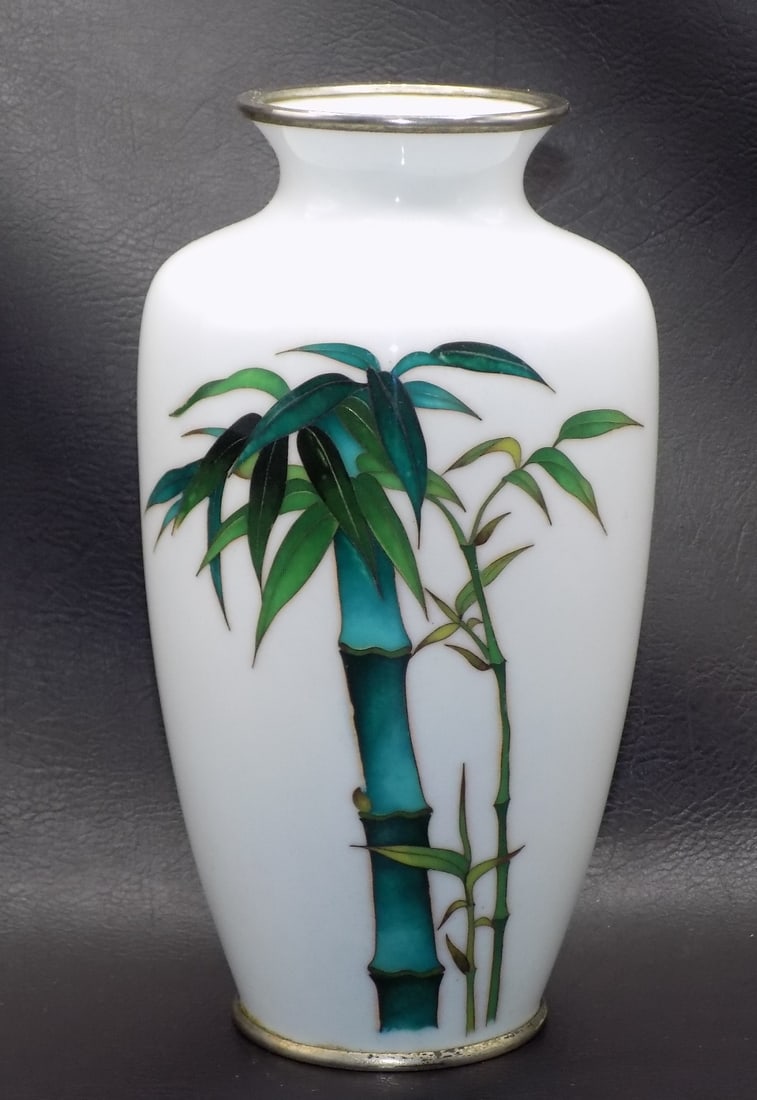 Antique Japanese vase with bamboo tree decoration: Antique Japanese vase with bamboo tree decoration. Silver rims. Beautiful colors. In very good original as found condition. Great quality and detail. 7 1/8 inches tall. For in house shipping, please c