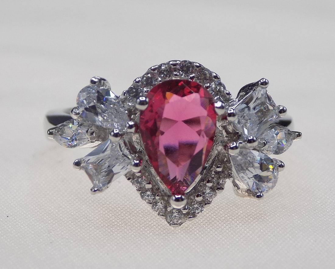 Beautiful 3cwt ruby and topaz sterling silver ring: Beautiful 3cwt ruby and topaz sterling silver ring. Lab created ruby. Size 8. For in house shipping, please call Mike at Thriftiques 319-321-0613