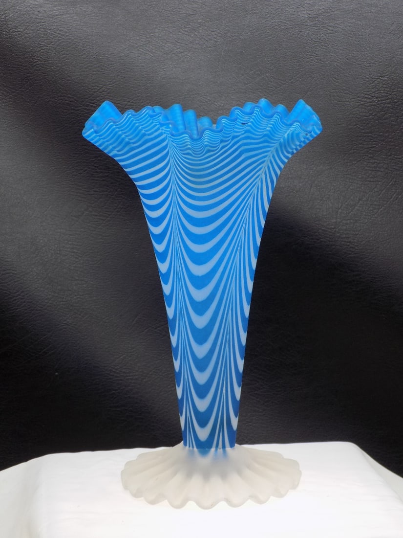 Unusual vintage Fenton art glass vase.: Unusual vintage Fenton art glass vase. Blue opalescent spiral optic vase. Beautiful colors. In very good original as found condition. Great quality and detail. 8 1/8 inches tall. For in house shipping