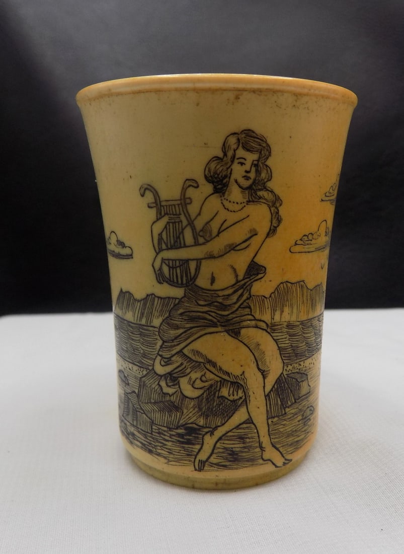 Scrimshaw seminude maiden steer horn shot glass: Scrimshaw seminude maiden steer horn shot glass. In very good original as found condition. Great quality and detail. 2 3/8 tall. For in house shipping, please call Mike at Thriftiques 319-321-0613