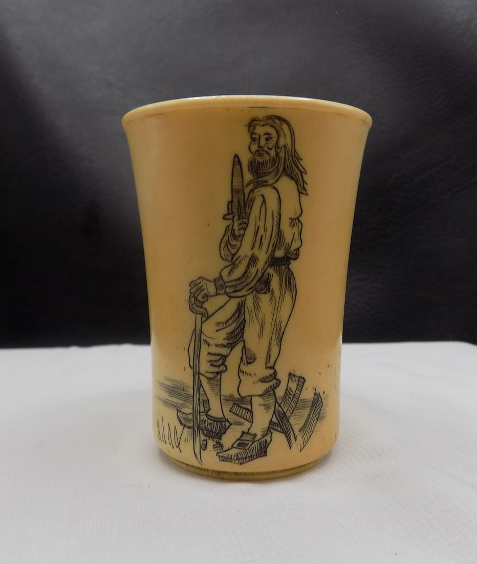 Scrimshaw pirate holding sword steer horn shot glass: Scrimshaw pirate holding sword steer horn shot glass. In very good original as found condition. Great quality and detail. 2 ½ tall. For in house shipping, please call Mike at Thriftiques 319-32