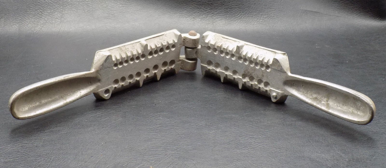 Antique fishing sinker mold: Antique fishing sinker mold. Marked Palmer West Newton Pennsylvania. In very good original as found condition. Great quality and detail. 8 inches long closed x 1 7/8 wide. For in house shipping, pleas