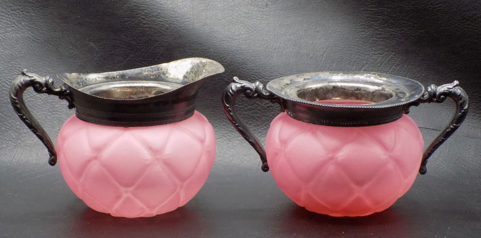 Antique diamond quilted pink satin glass art glass creamer and sugar.: Antique diamond quilted pink satin glass art glass creamer and sugar. Beautiful colors. In very good original as found condition. Great quality and detail. Creamer 3 ¾ tall at spout. 5 5/8 inch