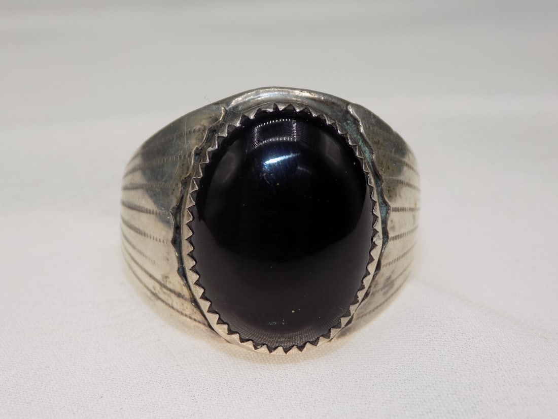 Vintage Native American Indian sterling black onyx gemstone ring: Vintage Native American Indian sterling black onyx gemstone ring. Size 12 ½. White lines or dots are camera flash reflection. For in house shipping, please call Mike at Thriftiques 319-321-0613