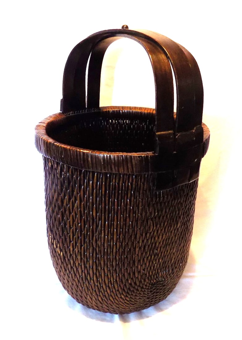 Large Chinese handwoven gathering or fisherman’s basket: Large Chinese handwoven gathering or fisherman’s basket. Please see photos for age and condition. 23 inches tall x 14 wide at center opening. Great quality and detail. For in house shipping, please