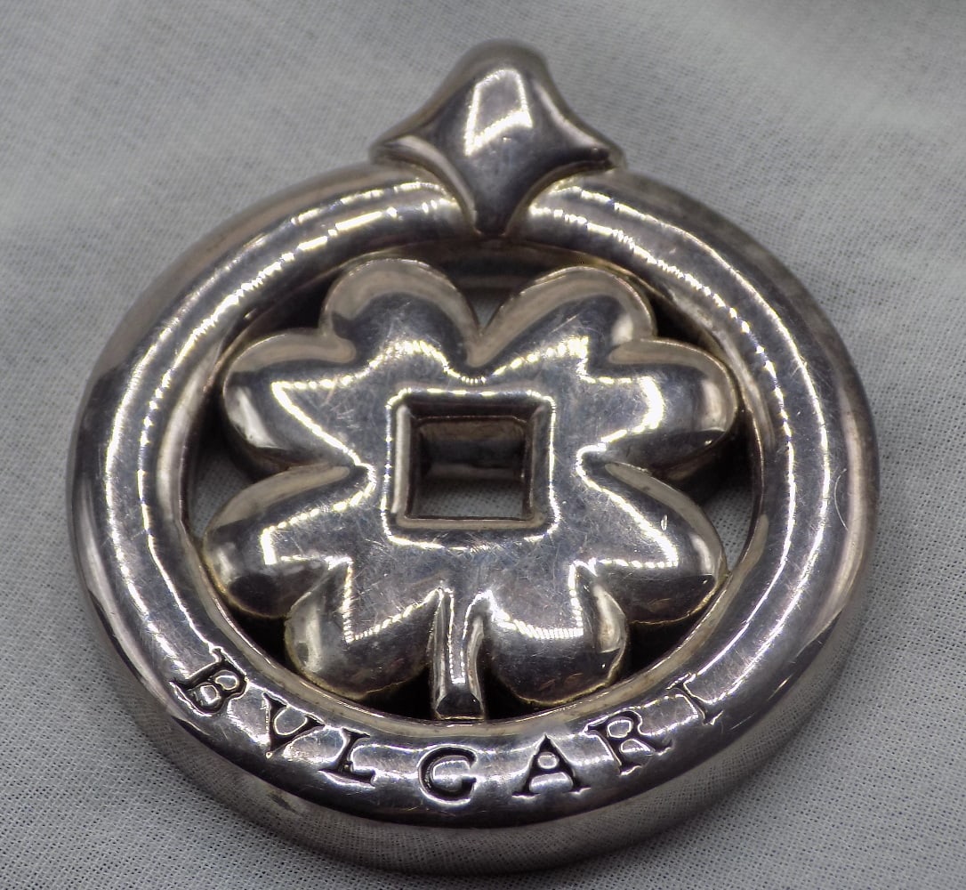 Vintage sterling pendant: Vintage sterling pendant. Marked BVLCARI Tondo clover pendant. as shown in photo. 1 ¾ inches tall. In very good original as found condition. Great quality and detail. White lines or dots are ca