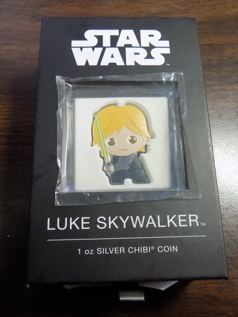 One ounce silver Star Wars Luke Skywalker in Original unopened box.: One ounce silver Star Wars Luke Skywalker in Original unopened box. Beautiful colors. In very good original as found condition. Great quality and detail. Box size is 4 ¾ x 3 x 1 ½ inches