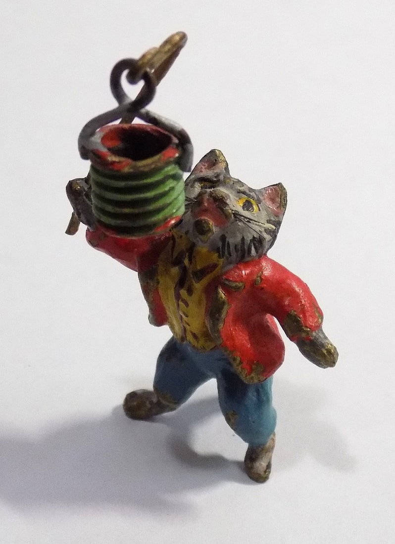 Antique Austrian Vienna Cold Painted Bronze cat .: Antique Austrian Vienna Cold Painted Bronze Cat Holding Swaying Pail over Head. Some minimal paint wear. Cat is 3/4" long and 2" tall. Beautiful colors. In very good original as found condition. Great