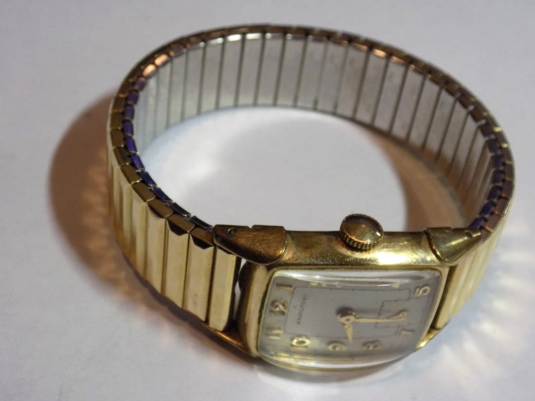 Vintage Hamilton 987 17 jewel 14k gold fill wristwatch: Vintage Hamilton 987 17 jewel 14k gold fill wristwatch. Running at time of listing. Adjustable band. could not remove back for fear of harming. Watch 3/4 wide, not including stem