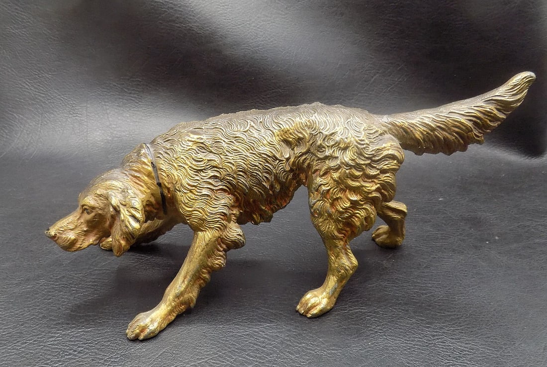 Antique cast iron Irish Setter dog. Original patina: Antique cast iron Irish Setter dog. Original patina. In very good original as found condition. Great quality and detail. 9 inches long x 4 ¾ tall at top of tail. For in house shipping, please cal