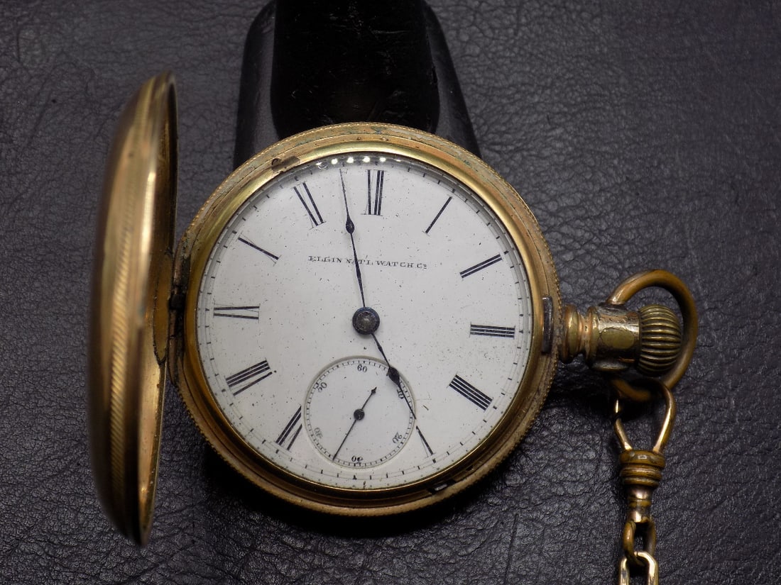 Antique hunting case pocket watch with 1886 bill of sale.: Antique hunting case pocket watch with 1886 bill of sale. White porcelain dial marked Elgin Natl. Watch Co. In very good original as found condition. Great quality and detail. Shows wear to edge of ca