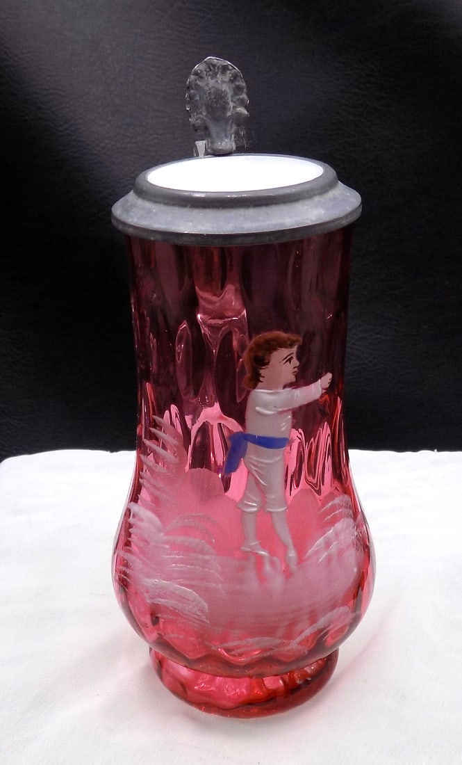 Vintage cranberry thumb print decorated art glass stein with pewter lid: Vintage cranberry thumb print decorated art glass stein with pewter lid. Internal air bubble in base is original in making. Hand painted decoration of child. Beautiful colors. In very good original as