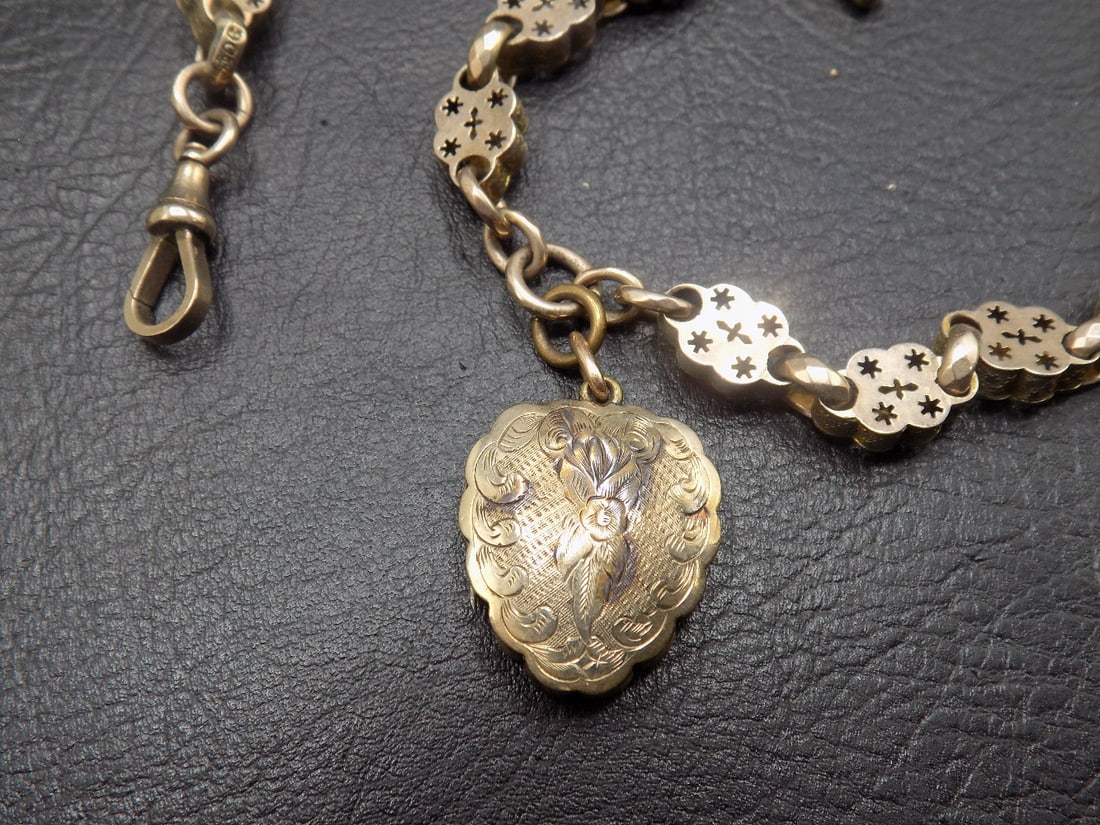 Antique 9 ct gold watch fob with heart shaped photo locket: Antique 9 ct gold watch fob with heart shaped photo locket. Marked as shown in photo. In very good original as found condition. Great quality and detail. Fob total length 14 inches. Locket 7/8 inch ta