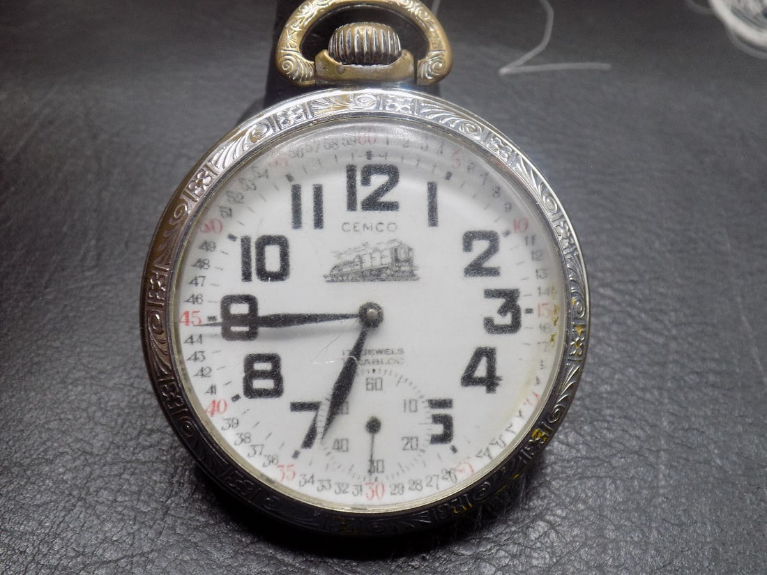 Vintage Swiss 17 jewel pocket watch with train on back: Vintage Swiss 17 jewel pocket watch with train on back. Marked as shown in photos. White porcelain dial. Running at time of listing. Please see photos for back of works and serial number. 1 7/8 inch w