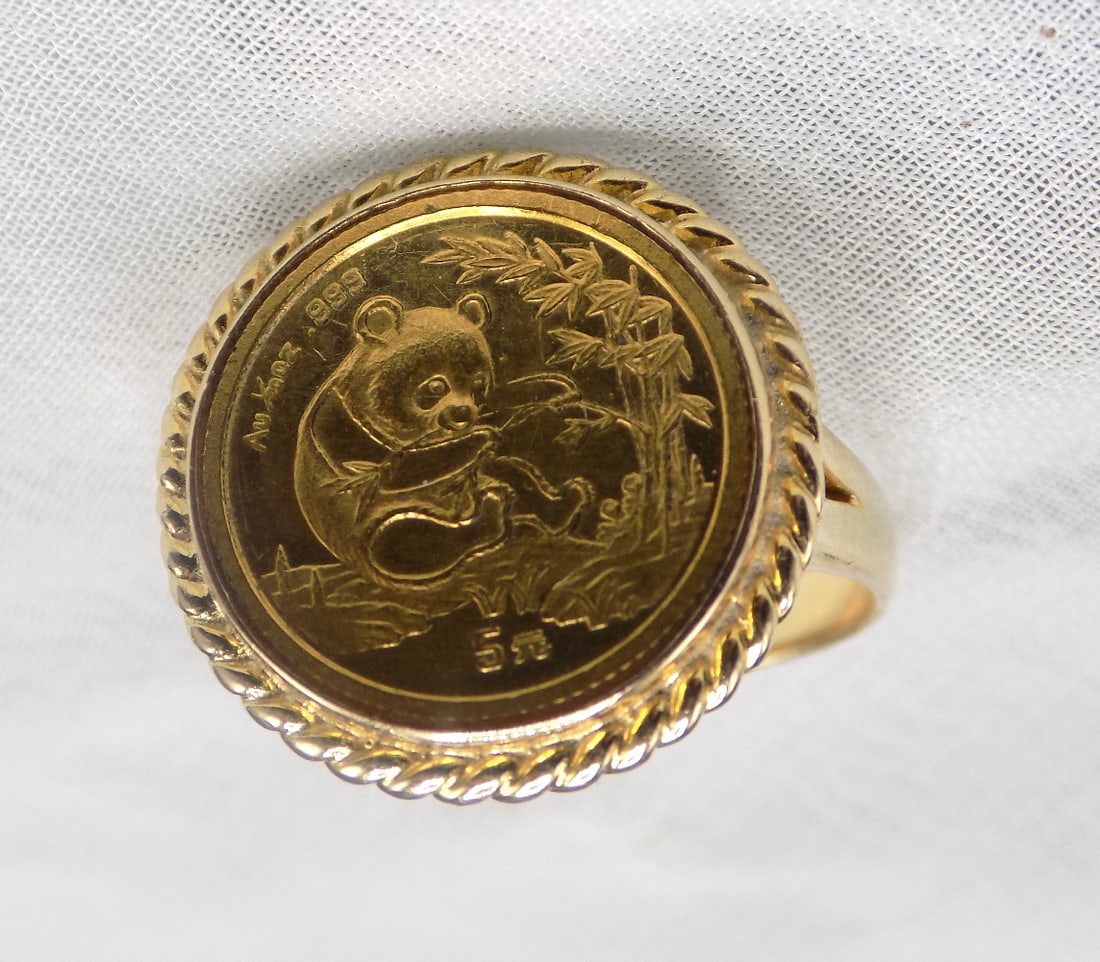 14k gold ring with inset Chinese Panda gold coin: 14k gold ring with inset Chinese Panda gold coin. Five yuan. Braided rope bezel. Total weight 5.3 grams. Size 6 ½. Beautiful colors. In very good original as found condition. Great quality and de
