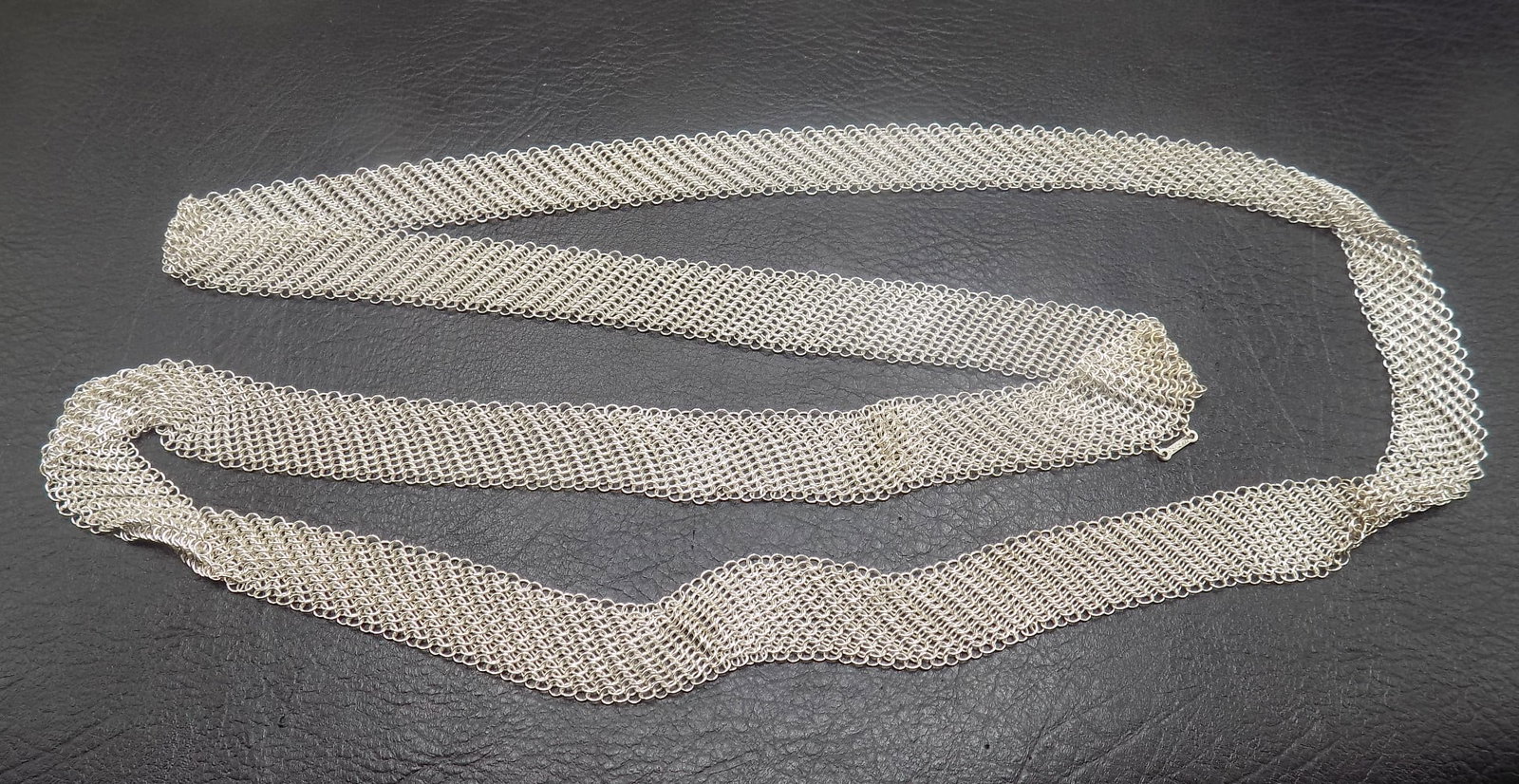 Tiffany and Co. Elsa Peretti sterling silver mesh scarf necklace: Tiffany and Co. Elsa Peretti sterling silver mesh scarf necklace. Marked as shown in photos. 51 grams. Great quality and detail. For in house shipping, please call Mike at Thriftiques 319-321-0613.