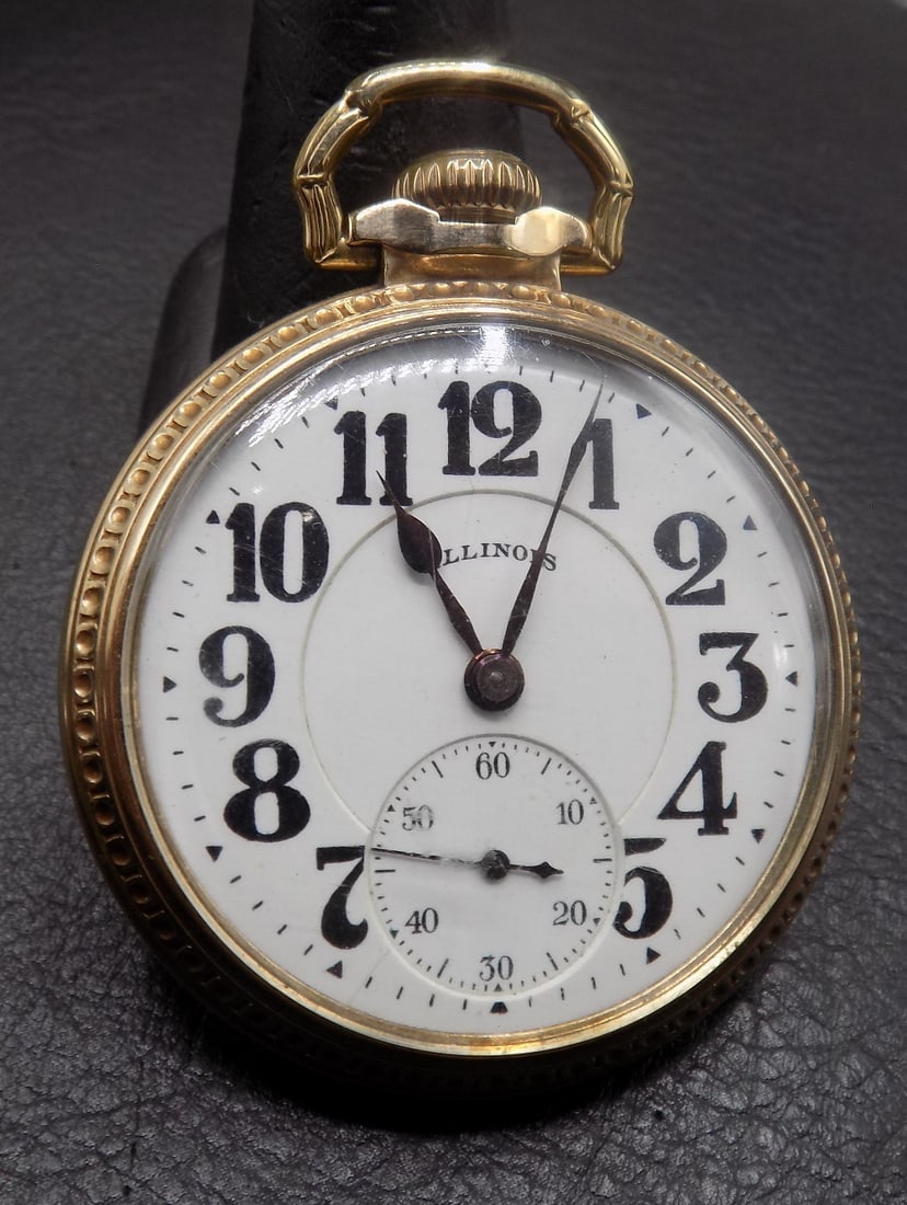 Vintage Illinois Bunn Special sixty hour 21 jewel Railroad grade pocket watch: Vintage Illinois Bunn Special sixty hour 21 jewel Railroad grade pocket watch. 10k gold fill case. Marked as shown in photos. White porcelain dial. Running at time of listing. Please see photos for
