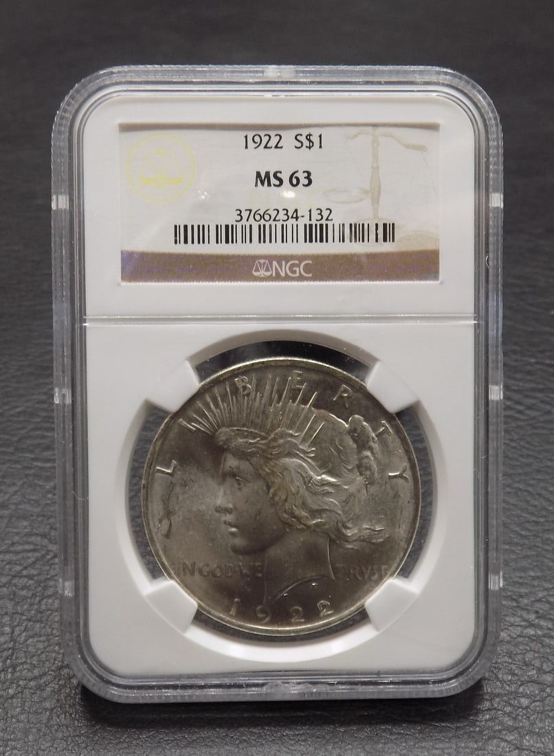 1922 Uncirculated MS 64 silver dollar graded by NGC: 1922 Uncirculated MS 64 silver dollar graded by NGC. Please see photos. For in house shipping. Please call Mike at Thriftiques 319-321-0613
