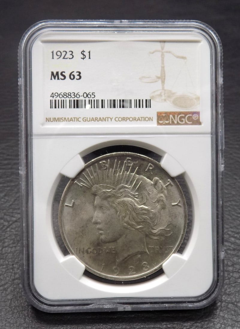 1923 Uncirculated MS 63 silver dollar graded by NGC: 1923 Uncirculated MS 63 silver dollar graded by NGC. Please see photos. For in house shipping. Please call Mike at Thriftiques 319-321-0613.