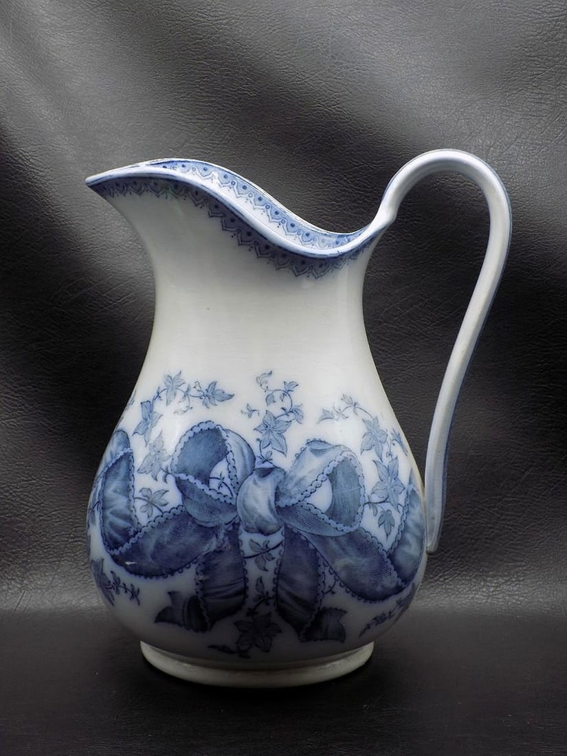 Antique blue and white hand painted pitcher. (1 of 8)