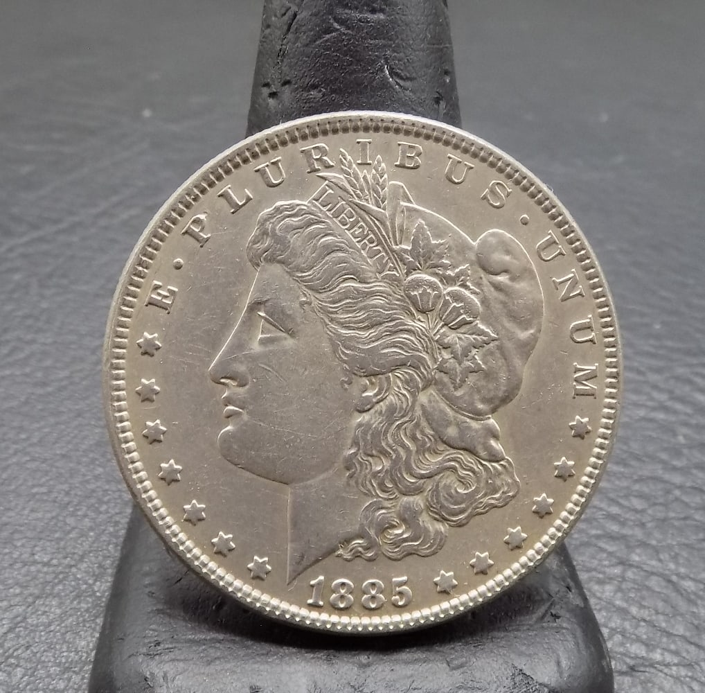 Uncirculated 1885 Morgan silver dollar.: Uncirculated 1885 Morgan silver dollar. Please see photos. For in house shipping, please call Mike at Thriftiques 319-321-0613