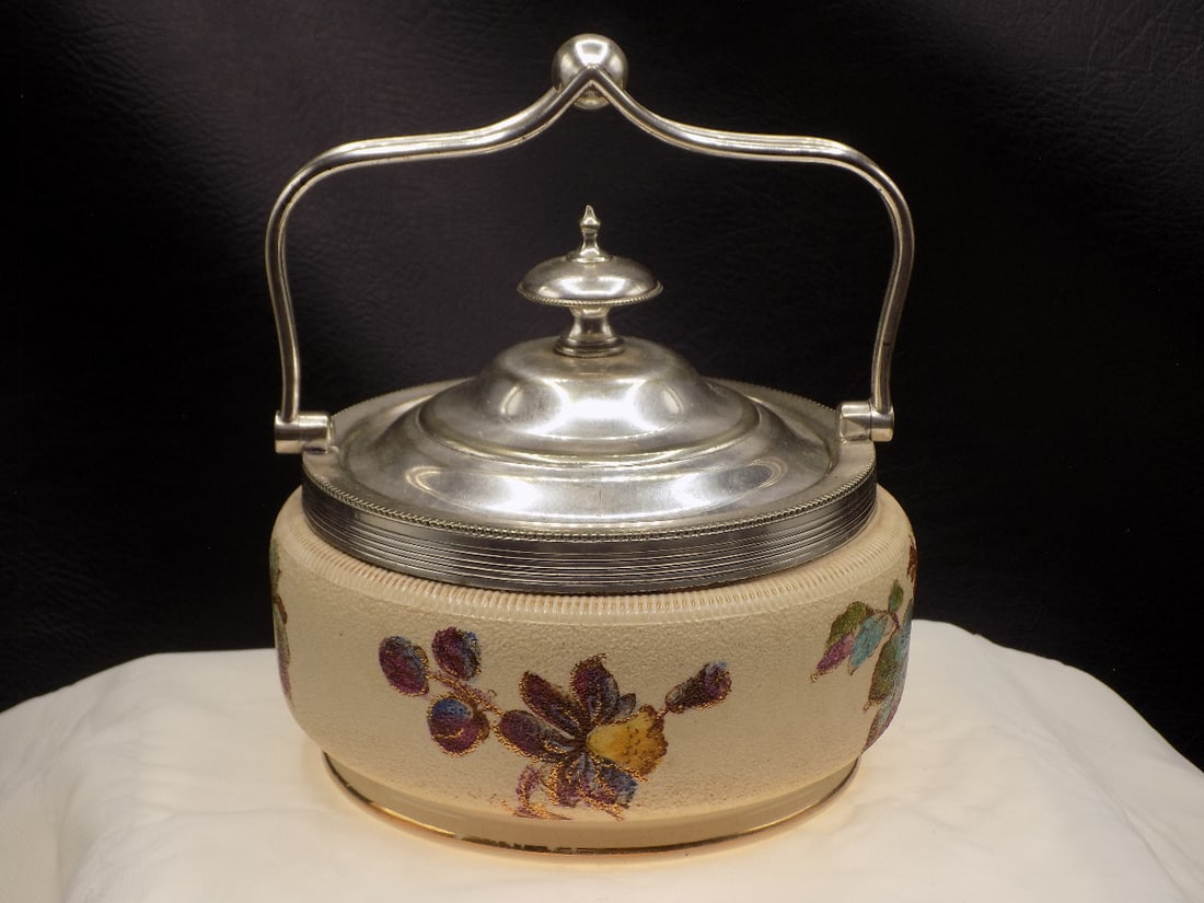 Vintage covered jar by Taylor Tunnicliffe and Co: Vintage covered jar by Taylor Tunnicliffe and Co. Marked on bottom as shown in photo. Silverplate handle and lid. Beautiful colors. In very good original as found condition. Great quality and detail. 