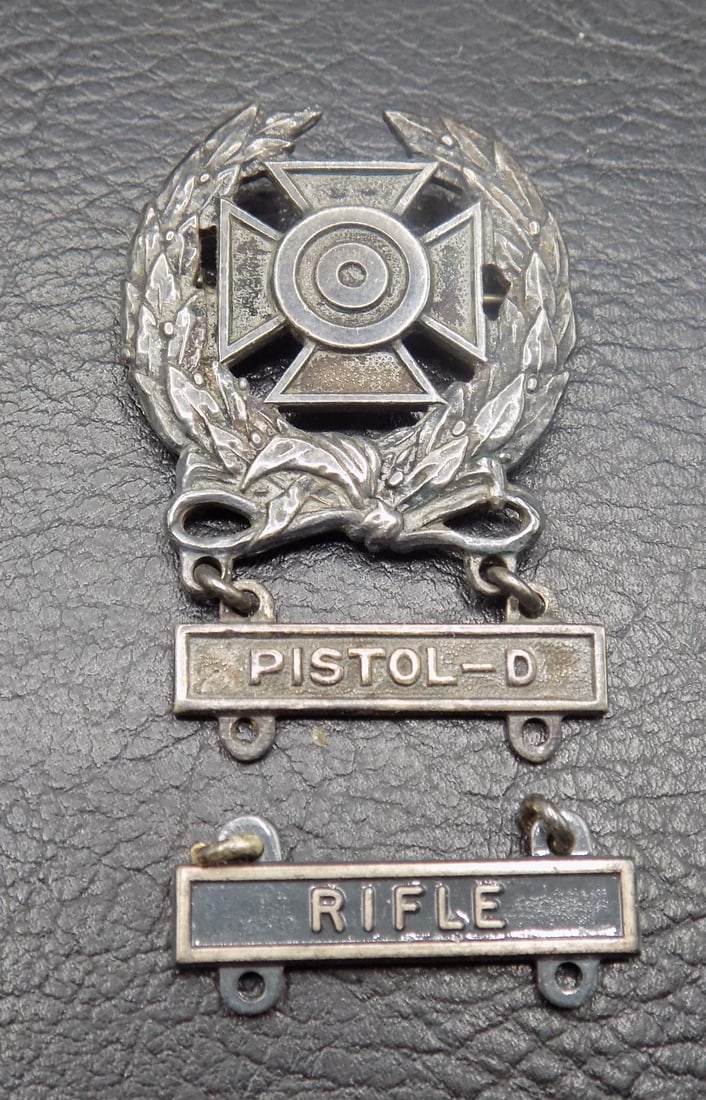 Vintage sterling silver World War II Marksman medal: Vintage sterling silver World War II Marksman medal. In very good original as found condition. Great quality and detail. 2 1/8 inches tall x 1 1/8 width. For in house shipping, please call Mike at Thr