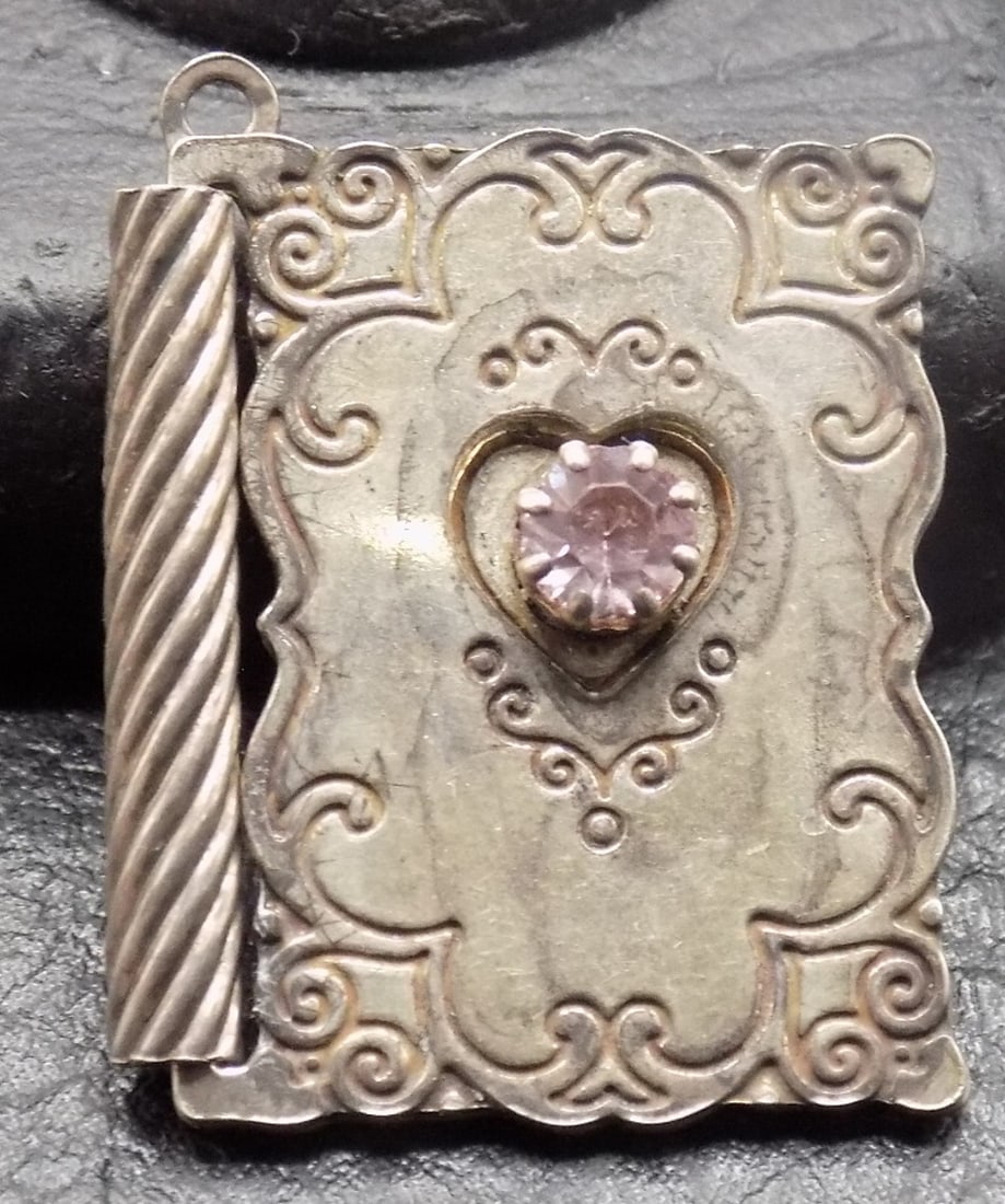 Fancy miniature charm book with amethyst gemstone: Fancy miniature charm book with amethyst gemstone. Etched With Love pendant. Beautiful colors. In very good original as found condition. Great quality and detail. 1 inch tall x ¾ wide closed. For