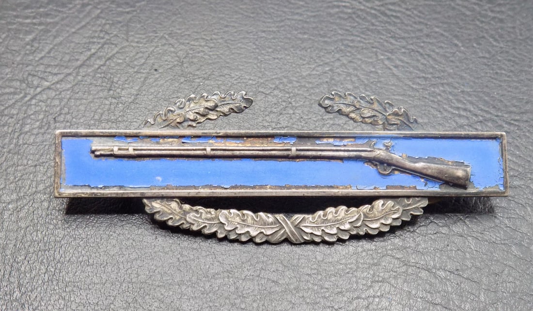 Sterling silver WWII Army Combat Infantry badge: Sterling silver WWII Army Combat Infantry badge. Marked as shown in photo. In very good original as found condition. Great quality and detail. 3 inches long. For in house shipping, please call Mike at