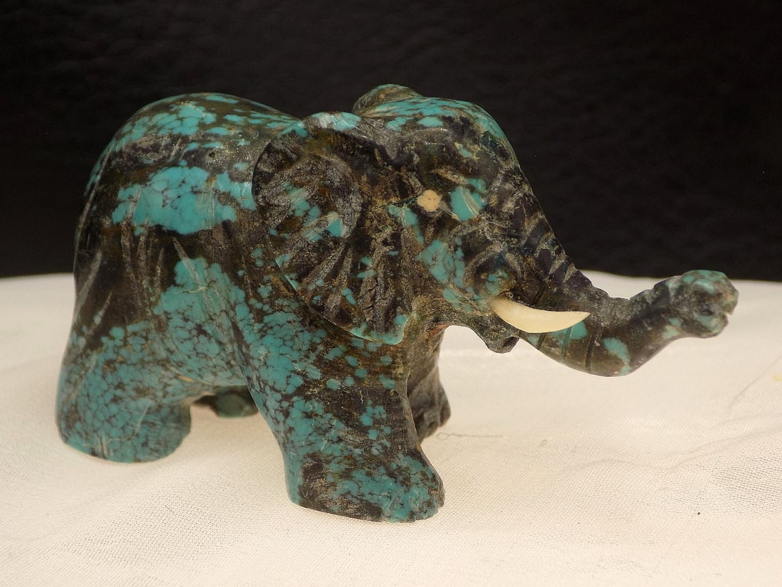 Vintage polished hand carved Chrysocolla elephant: Vintage polished hand carved Chrysocolla elephant. Missing one tusk as shown in photo. Beautiful colors. Great quality and detail. 2 ¼ long x 1 ¼ tall. For in house shipping, please call Mik