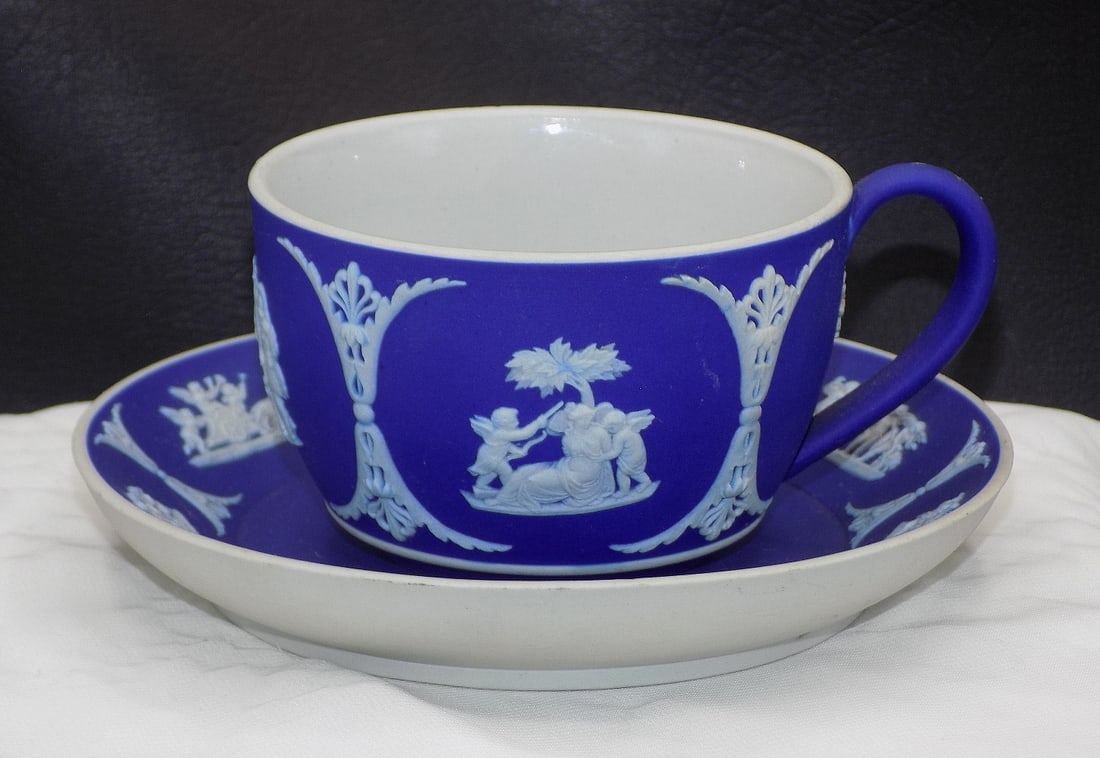 Vintage Wedgwood Jasperware cup and saucer with classical scene: Vintage Wedgwood Jasperware cup and saucer with classical scene. Marked on bottom as shown in photo. Beautiful colors. In very good original as found condition. Great quality and detail. Saucer is 5 &