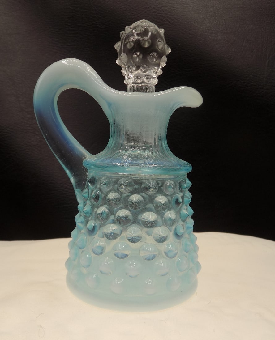Vintage Fenton art glass blue opalescent hobnail cruet: Vintage Fenton art glass blue opalescent hobnail cruet. Beautiful colors. In very good original as found condition. Great quality and detail. 4 ¾ inches tall. For in house shipping, please call M