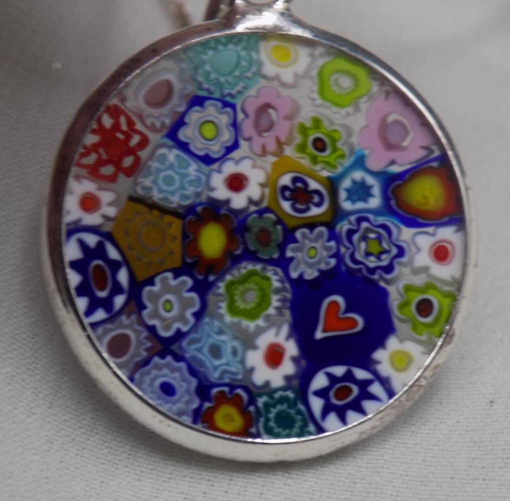 Vintage millefiori sterling silver necklace: Vintage millefiori sterling silver necklace. Marked as shown in photo Italy 925. Beautiful colors. In very good original as found condition. Great quality and detail. Pendant 7/8. Chain is 23 inches t