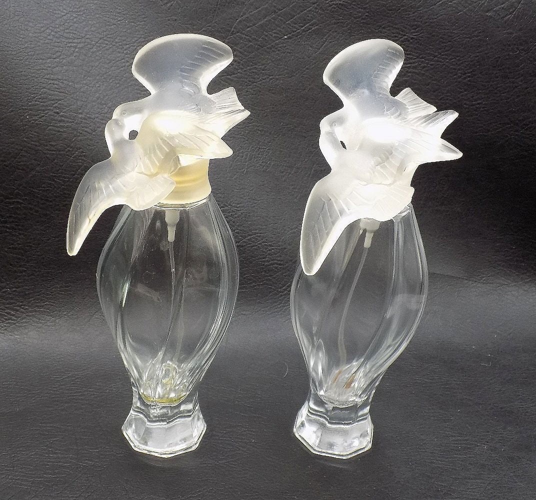 Great pair of vintage Lalique art glass store display perfume bottles: Great pair of vintage Lalique art glass store display perfume bottles. Marked on bottom Made in France L Air Du Temps Nina Ricci perfume tester. Did not find a Lalique mark. Bird stoppers typical of L