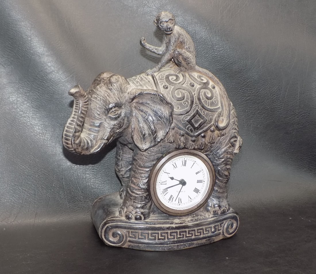 Unusual cast metal clock with monkey riding elephant (1 of 7)