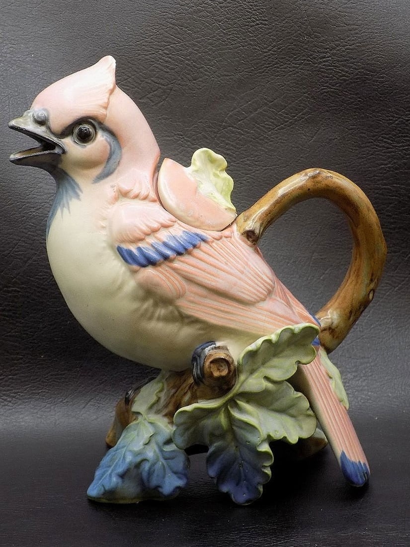 Unusual vintage porcelain bird cream pitcher: Unusual vintage porcelain bird cream pitcher. Marked on back of tail Takahashi San Francisco Co. Japan as shown in photo. Beautiful soft colors. Great quality and detail. 7 5/8 inches tall. 1 pound 3 