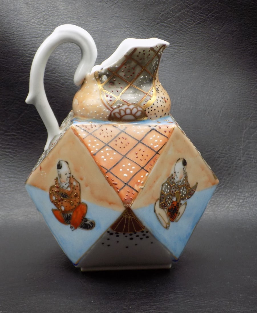 Antique Japanese Satsuma creamer.: Antique Japanese Satsuma creamer. Hand decorated. Unusual shape. Beautiful colors. In very good original as found condition. Great quality and detail. 5 ¾ inches tall x 5 ½ inches wide. 13 o