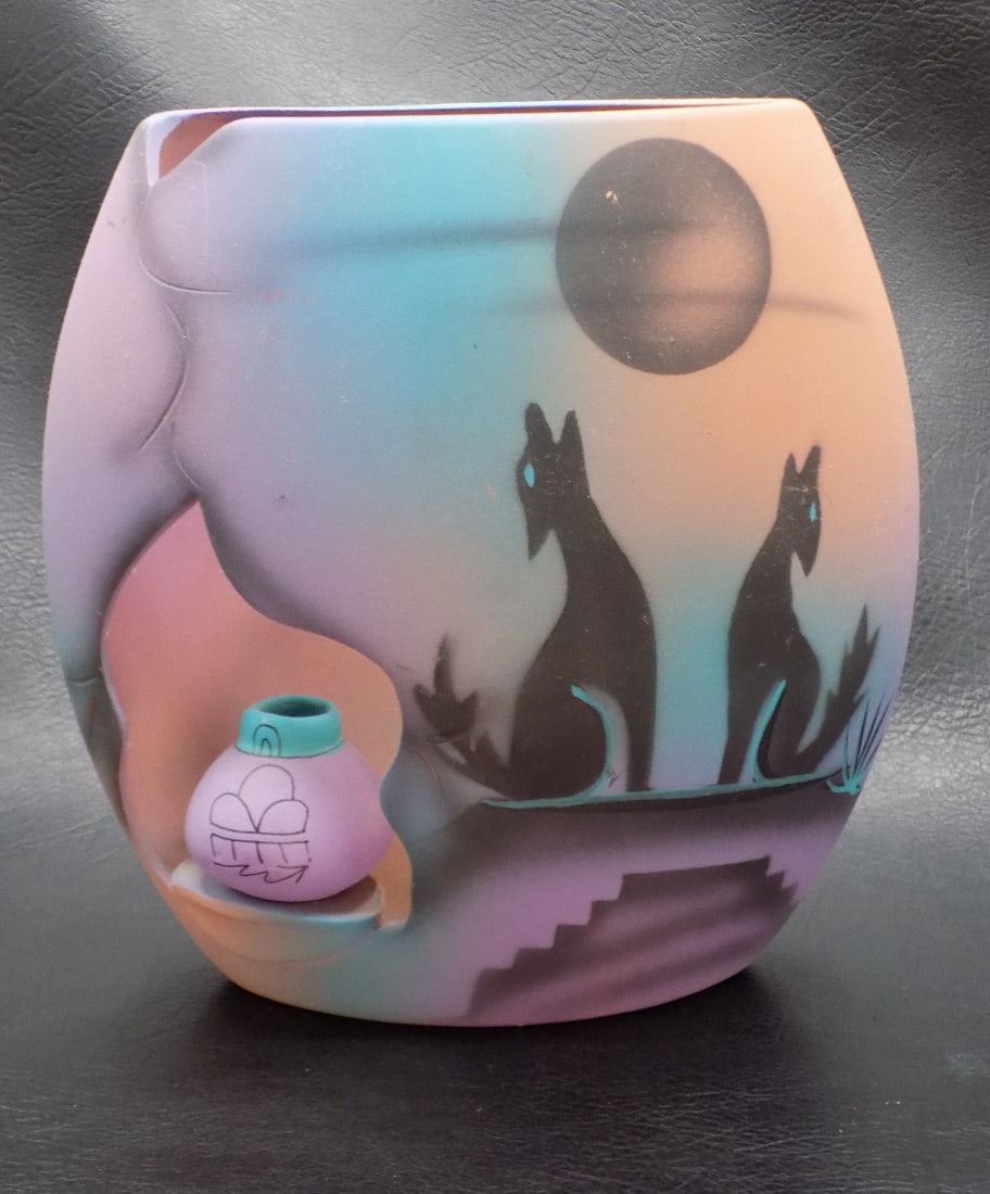 Fine handmade Native American Indian style vase: Fine handmade Native American Indian style vase. Artist signed and original label on bottom as shown in photo. Three dimensional vase with cut out pottery vase insert. Beautiful colors. In very good o