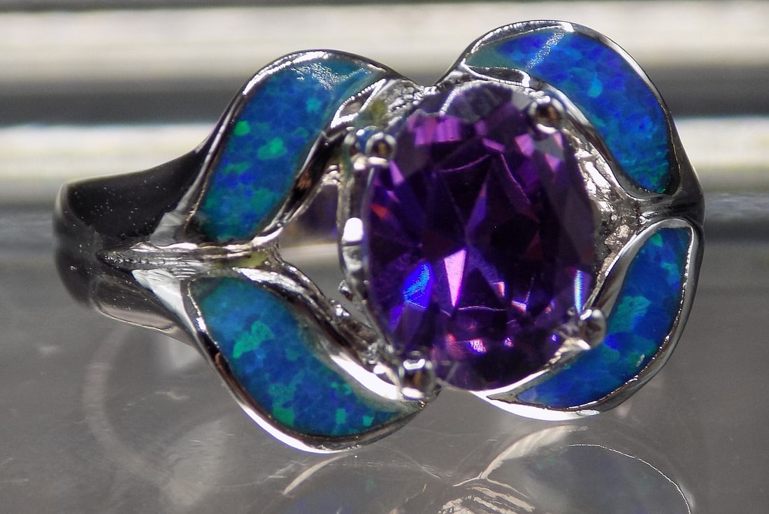 Beautiful 2 cwt sterling silver ring: Beautiful 2 cwt sterling silver ring. Lab created sapphire. Size 6. For in house shipping, please call Mike at Thriftiques 319-321-0613
