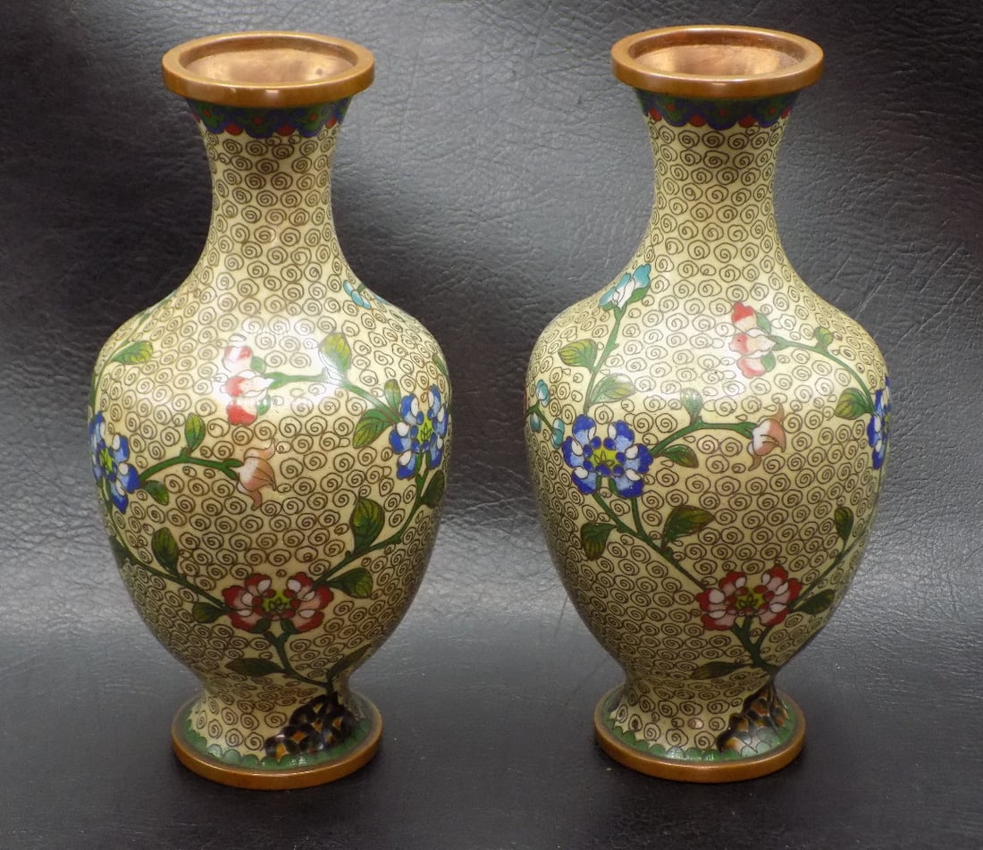 Pair of vintage Chinese cloisonne vases: Pair of vintage Chinese cloisonne vases. Beautiful colors. In very good original as found condition. Great quality and detail. 6 3/8 inches tall. 1 pound 14 ounces. White lines or dots are camera refl