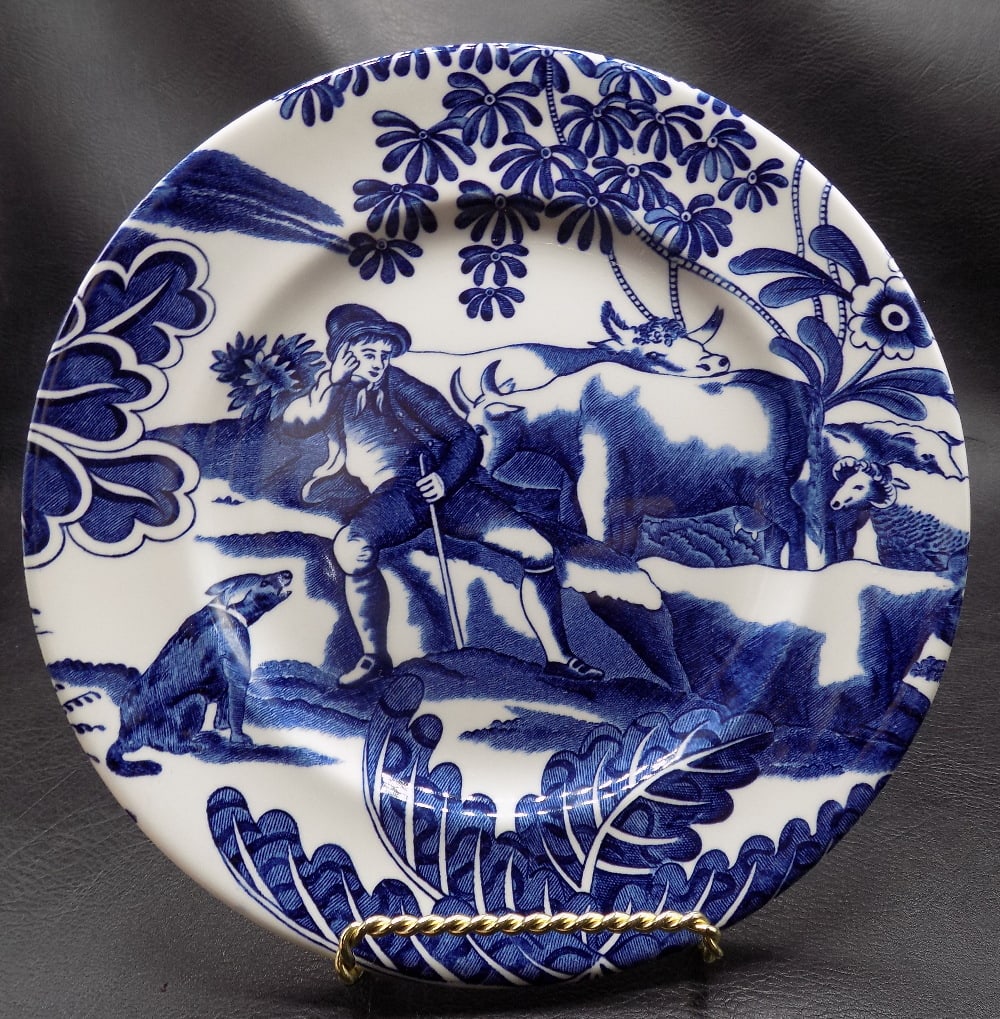 Vintage Tiffany blue and white plate: Vintage Tiffany blue and white plate. Man with cows and dog. Marked on back as shown in photo. Beautiful colors. In very good original as found condition. Great quality and detail. 7 ¾ wide. 12 o